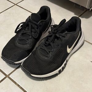 Nike Black Training Sneakers with Metallic Gold Swoosh